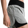 On Women's Performance Volt Shorts - BlackToe Running#colour_glacier