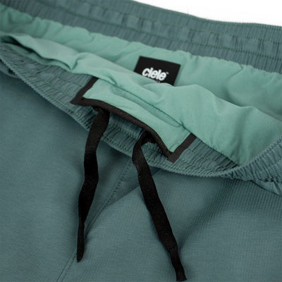 Ciele Women's AT 4" Brief Short - BlackToe Running#colour_silver-pine